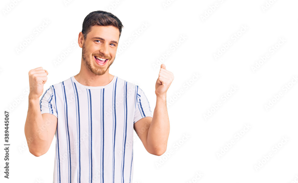 Handsome young man with bear wearing casual clothes screaming proud, celebrating victory and success very excited with raised arms Handsome young man with bear wearing casual clothes screaming proud, celebrating victory and success very excited with raised arms