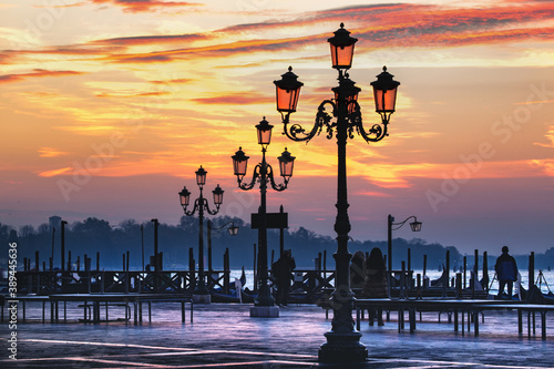 The lanterns on the waterfront against a beautiful sky, morning landscape in Venice, Italy. The neighborhood of Piazza San Marco. Venezia, Italia.