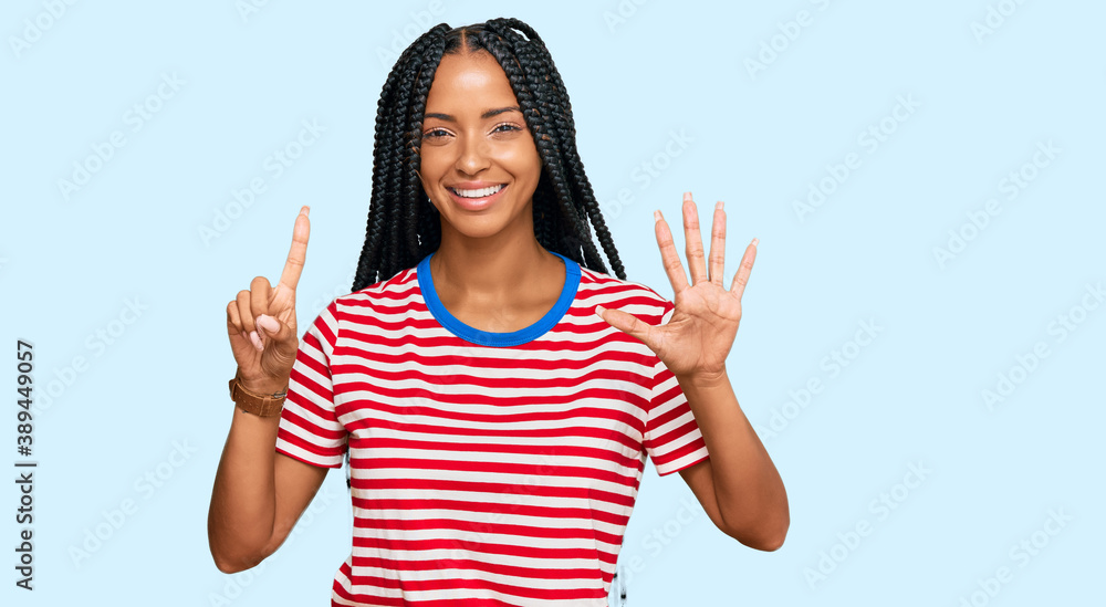Beautiful hispanic woman wearing casual clothes showing and pointing up with fingers number six while smiling confident and happy. Beautiful hispanic woman wearing casual clothes showing and pointing up with fingers number six while smiling confident and happy.