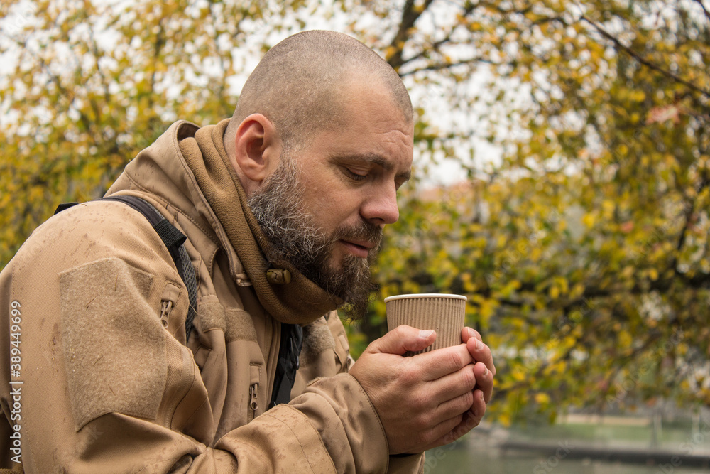 man with a cup of coffee man with a cup of coffee