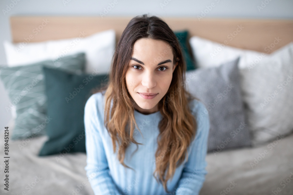 Portrait beautiful woman look at camera on couch. Portrait beautiful woman look at camera on couch.
