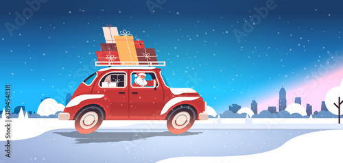 santa claus delivering gifts on red car merry christmas happy new year holidays celebration concept winter cityscape background horizontal vector illustration