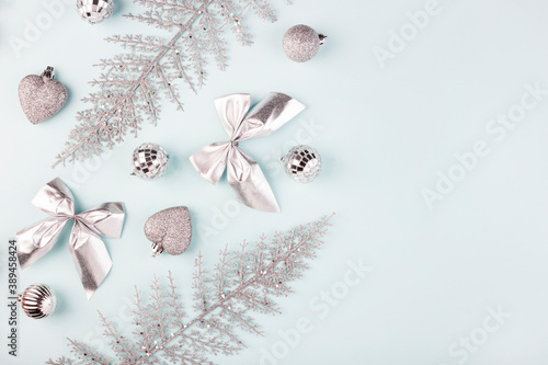 Christmas background, silver Christmas toys on a blue background, top view
