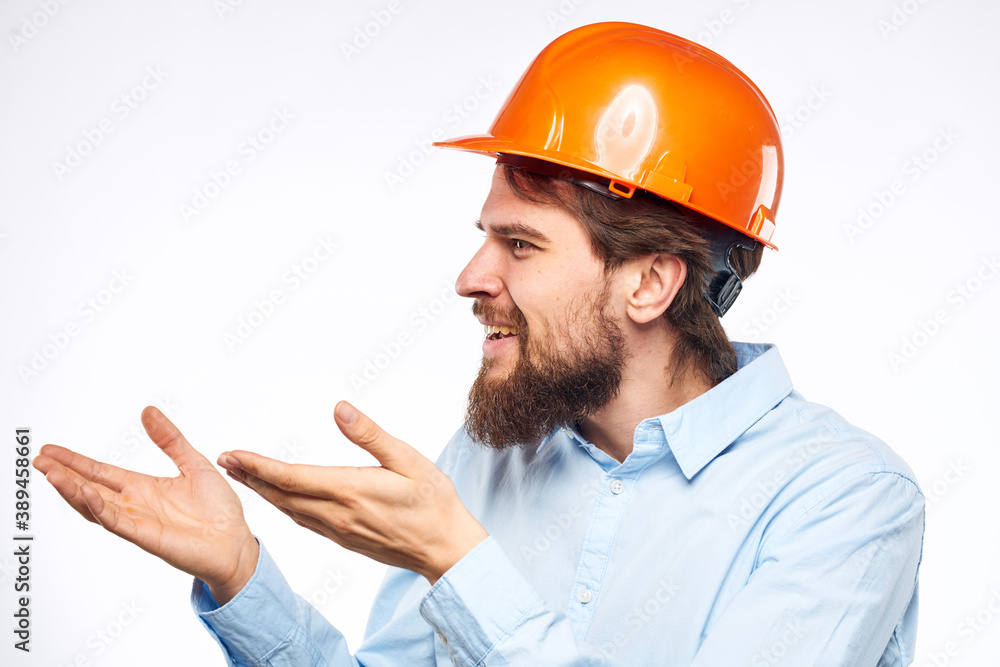 Man in orange helmet shirt construction engineer industry work