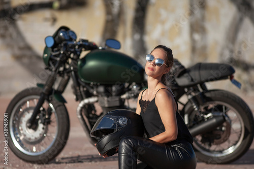 woman in black with a motorcycle