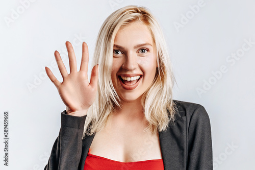 Wallpaper Mural Beautiful happy young girl smiles on gray isolated background Torontodigital.ca
