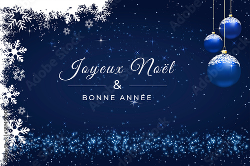 carte ou bandeau sur un joyeux noël et une bonne année en blanc sur un fond bleu et autour des boules de Noël , flocons de neige et des paillettes