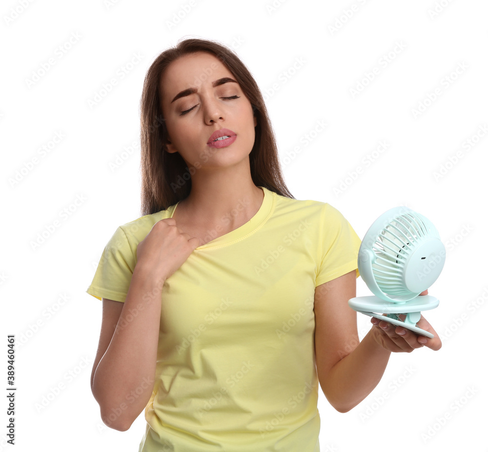 Woman with portable fan suffering from heat on white background. Summer season Woman with portable fan suffering from heat on white background. Summer season