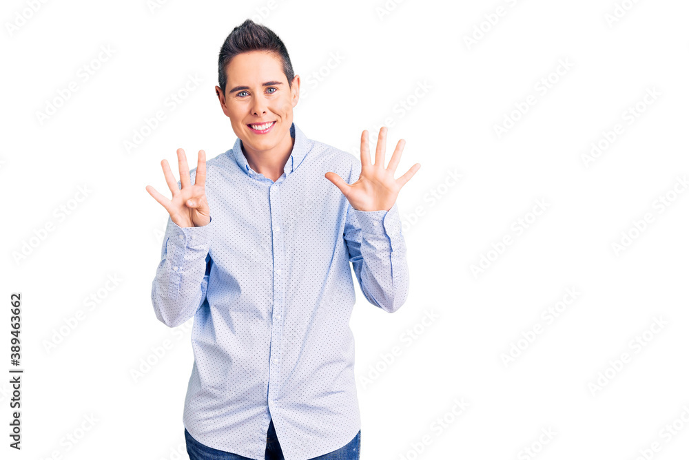 Young woman with short hair wearing business clothes showing and pointing up with fingers number nine while smiling confident and happy. Young woman with short hair wearing business clothes showing and pointing up with fingers number nine while smiling confident and happy.
