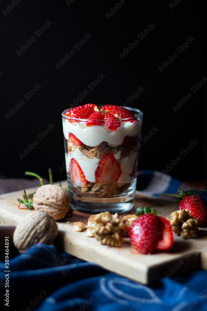 Strawberry and cream magnolia dessert in glass cup Strawberry and cream magnolia dessert in glass cup