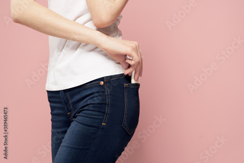 Woman with pad near jeans and hygiene protective agent for menstrual cycle © SHOTPRIME STUDIO