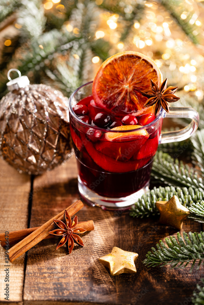 Christmas mulled wine with spices on a wooden rustic table. Christmas mulled wine with spices on a wooden rustic table.