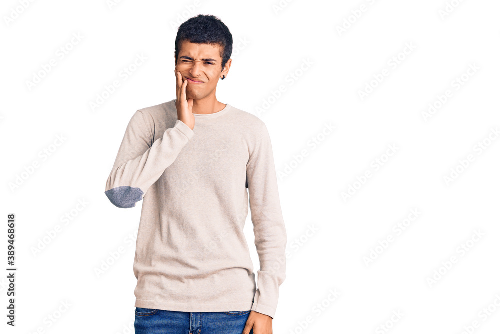 Young african amercian man wearing casual clothes touching mouth with hand with painful expression because of toothache or dental illness on teeth. dentist Young african amercian man wearing casual clothes touching mouth with hand with painful expression because of toothache or dental illness on teeth. dentist