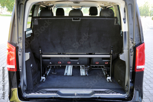 Rear view of the trunk and interior of a business class minibus. Luxury car interior.