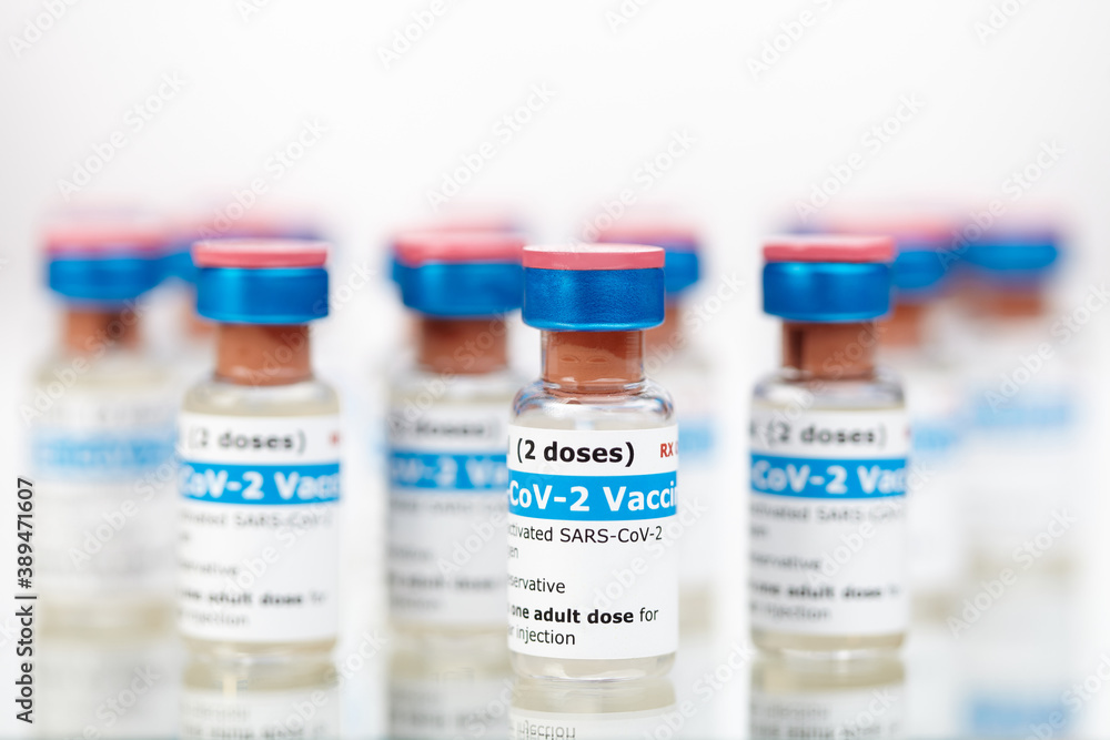 Bottles of new SARS-CoV-2 vaccine on table ready for application
