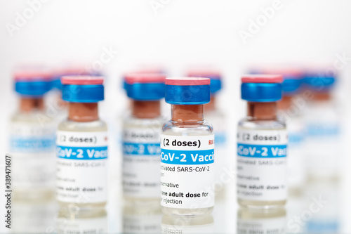 Bottles of new SARS-CoV-2 vaccine on table ready for application