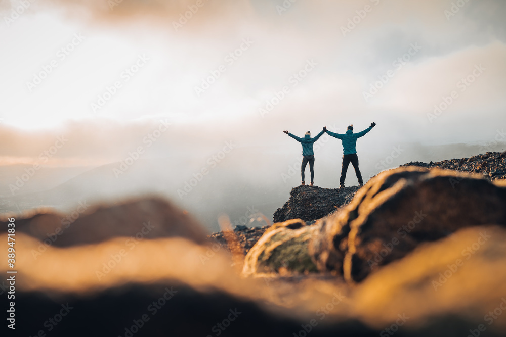 Couple travelers Man and Woman standing on cliff relaxing mountains and ...