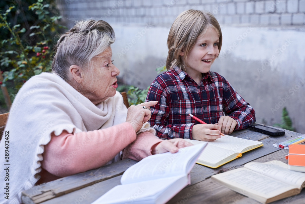 Grandmother reprimands her little blonde grandson Grandmother reprimands her little blonde grandson