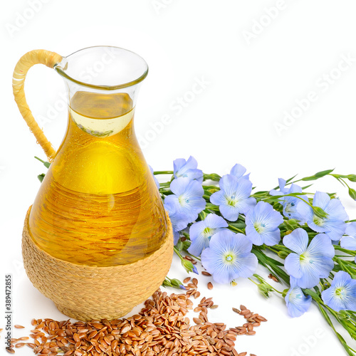 linseed oil, flaxseed and flowers isolated on a white