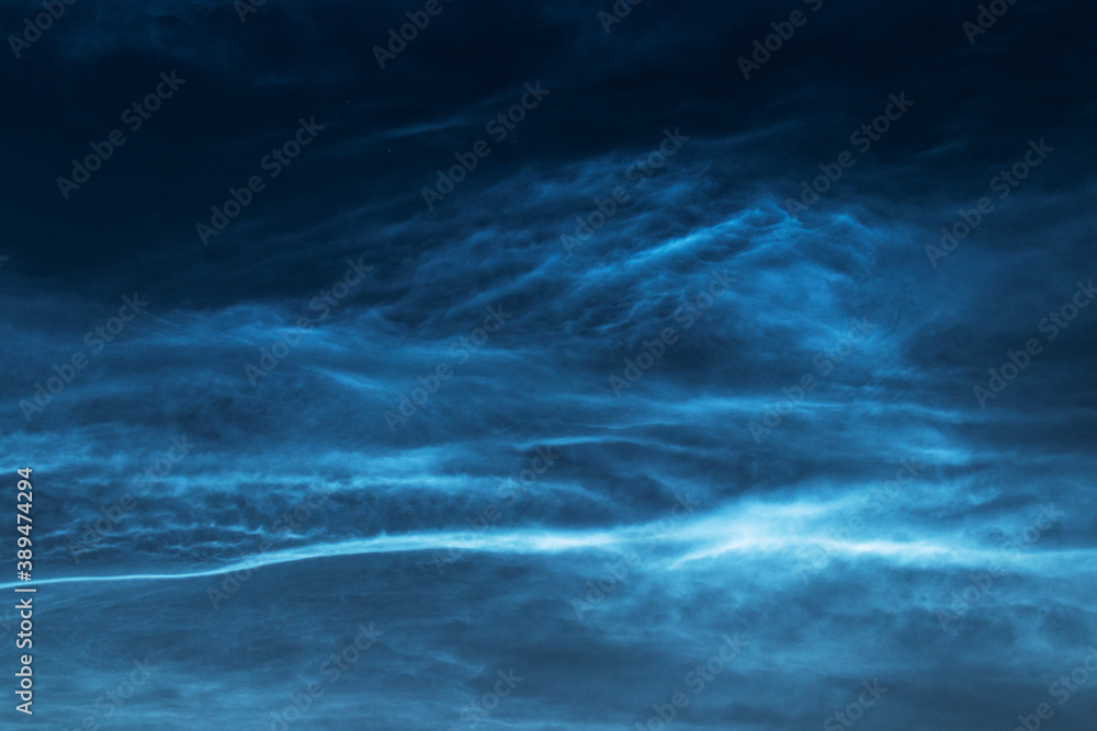 Noctilucent clouds or night shining clouds are tenuous cloud-like phenomena in the upper atmosphere of Earth, shot on a summer evening in Estonia. 