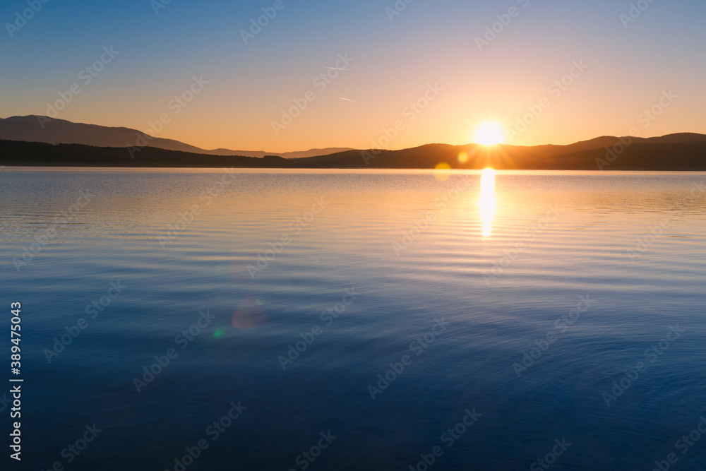 Spectacular sunrise scene over lake in Bulgaria. Amazing sunset/sunise landscapes.