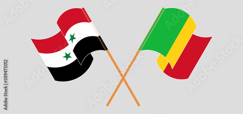 Crossed and waving flags of Mali and Syria