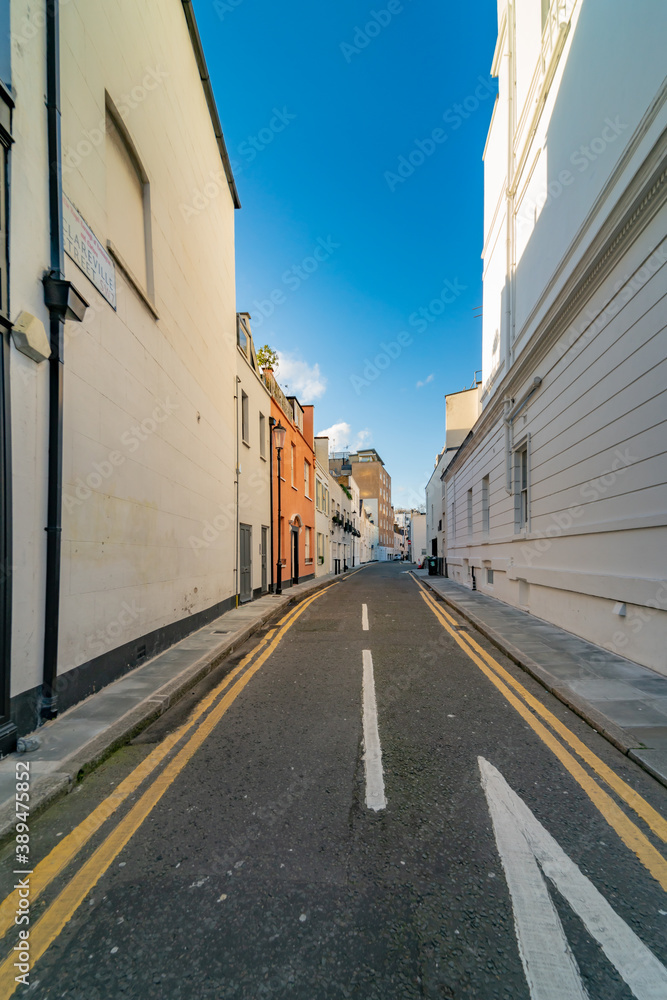 narrow street with houses and roadways in perspective, London