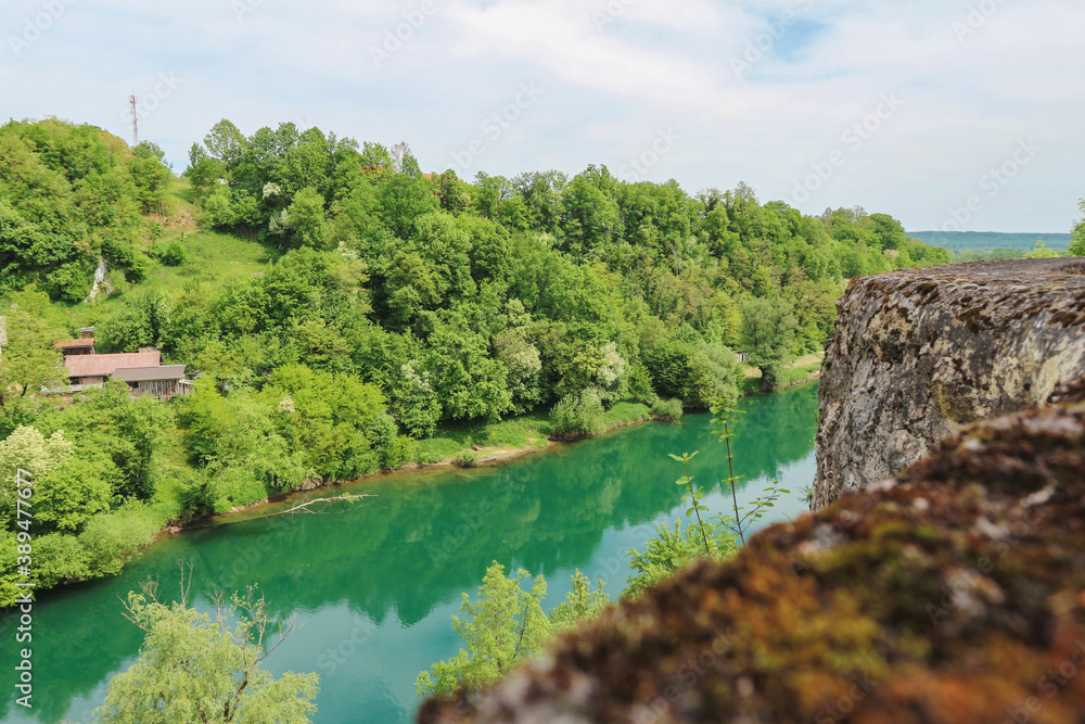 Fascinating Korana river coloured in green as the dense forest in its surroundings, beautiful tourist destination near the city of Karlovac, Croatia