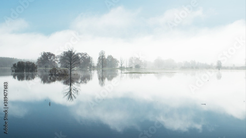 A panorama of Soomaa National Park during a autumnal flood also known as the Fifth season in a foggy morning in Estonian nature, Northern Europe. 