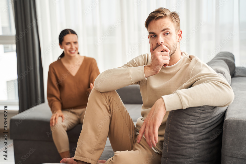 Woman gesticulating while talking to her husband Woman gesticulating while talking to her husband