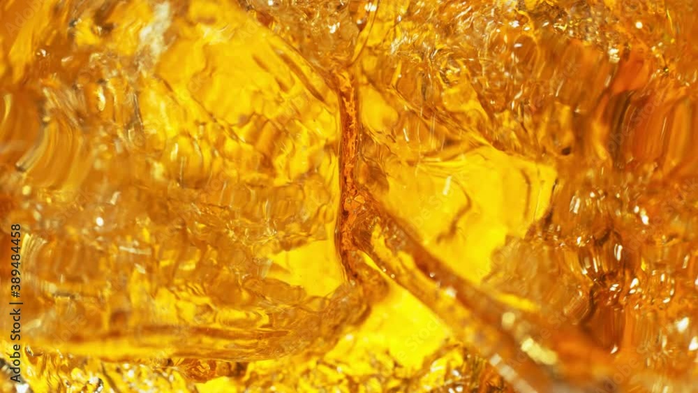 Super Slow Motion Shot of Pouring Golden Liquid at 1000 fps. Super Slow Motion Shot of Pouring Golden Liquid at 1000 fps.