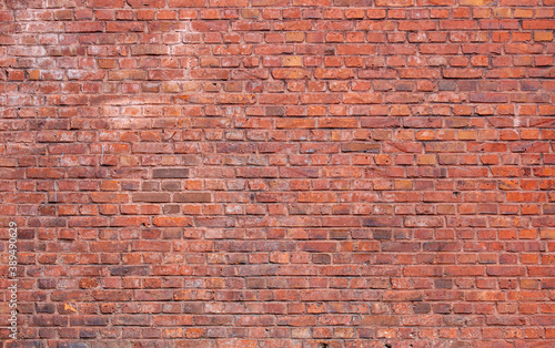 texture of old grunge red brick wall background 