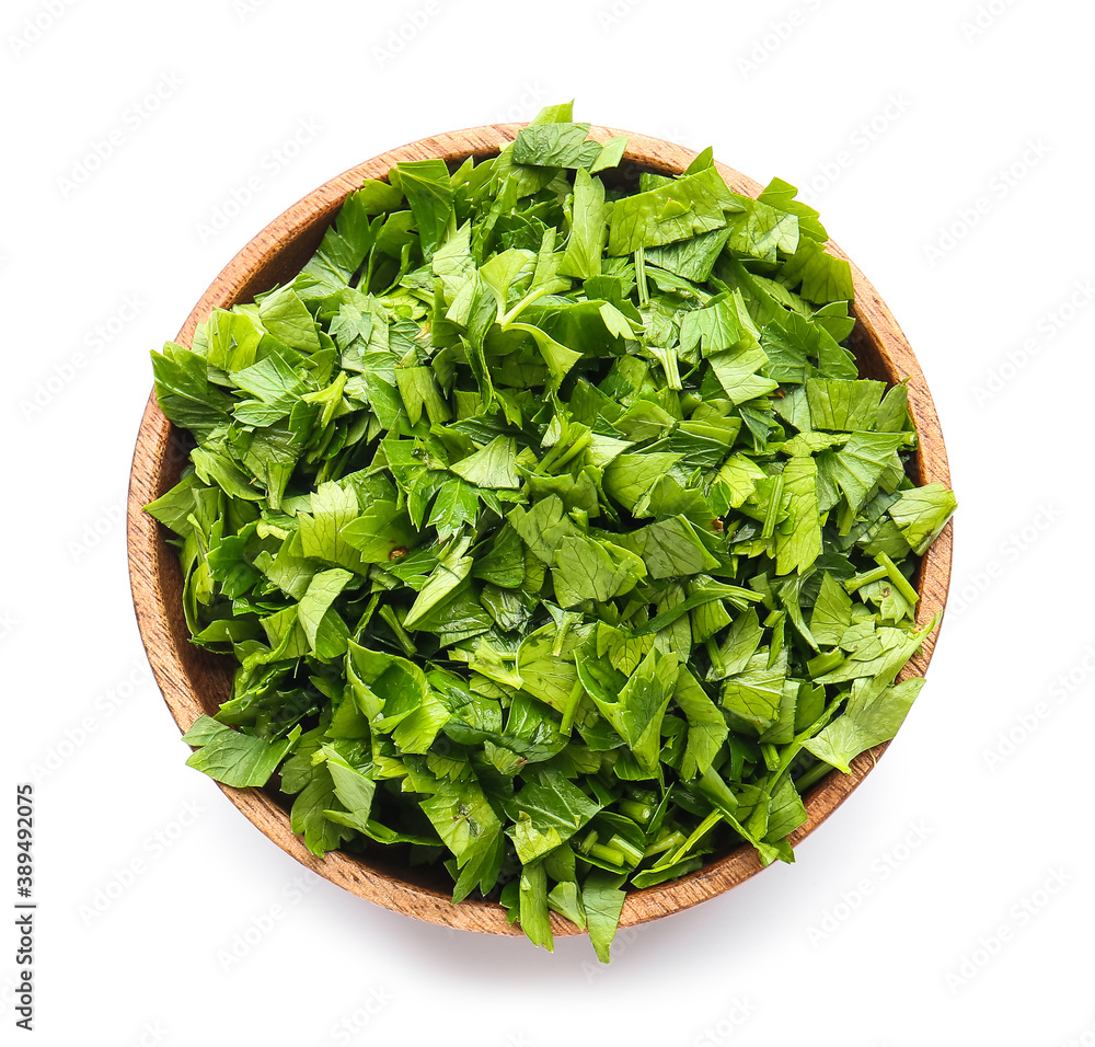 Fresh parsley in bowl on white background Fresh parsley in bowl on white background