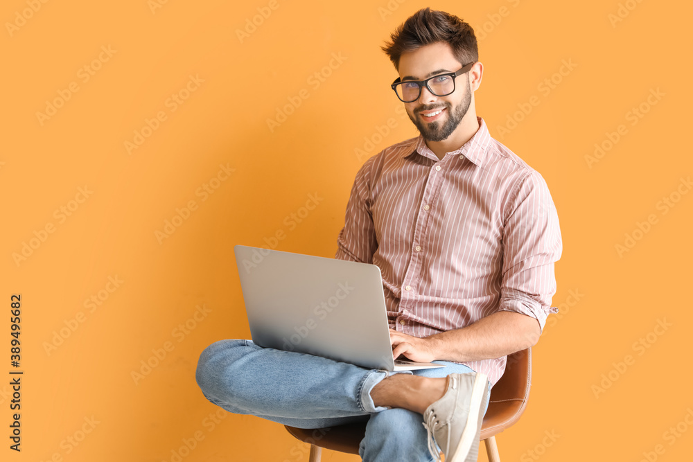 Man with laptop studying online on color background Man with laptop studying online on color background