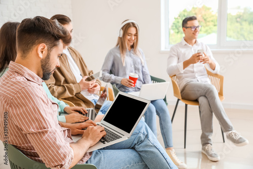 Students with modern device...