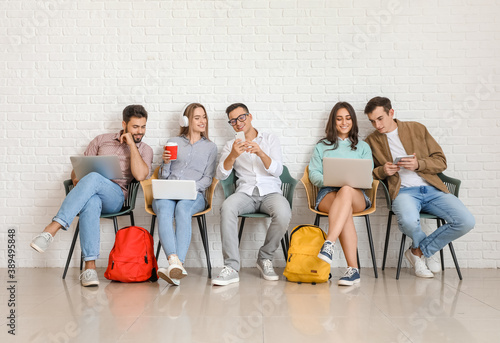 Students with modern device...