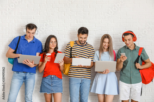 Students with modern device...