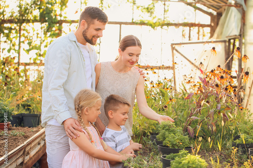 Young family working in garden