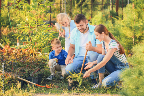 Young family working in garden