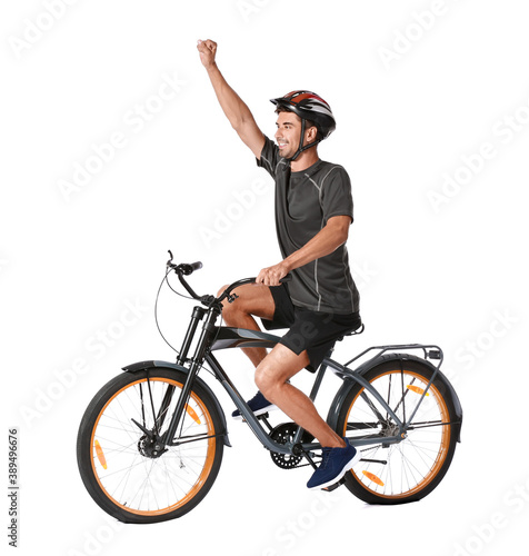 Male cyclist riding bicycle on white background