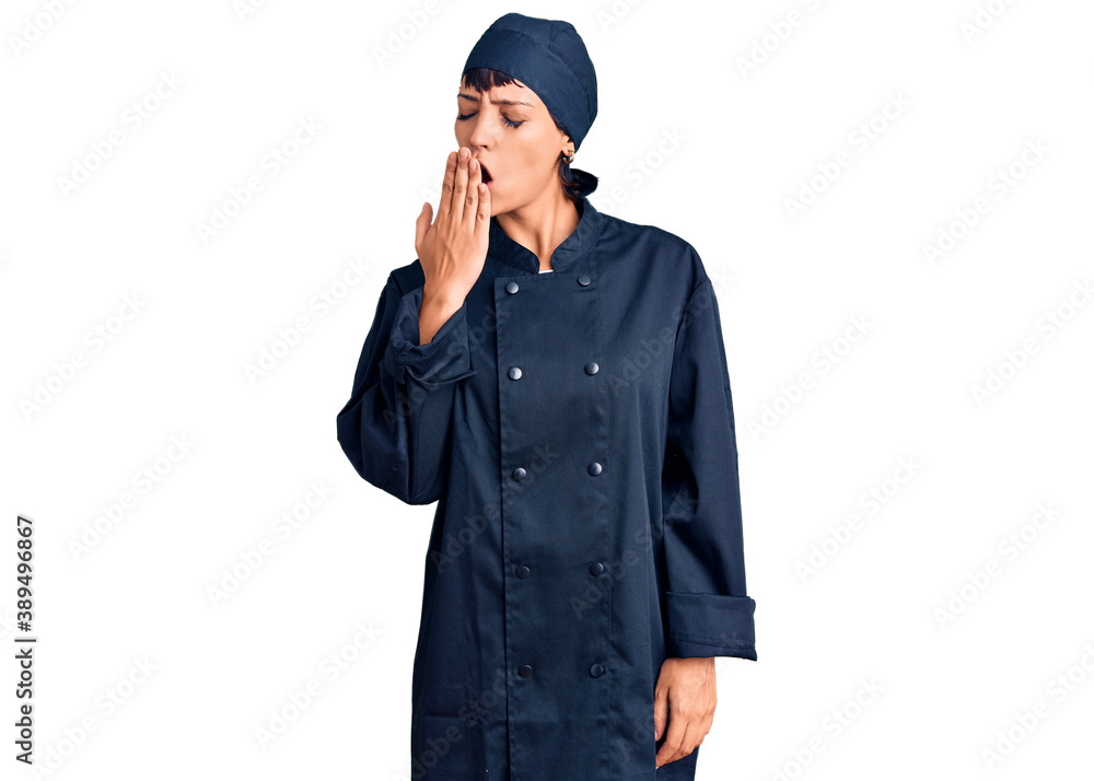 Young brunette woman with short hair wearing professional cook uniform bored yawning tired covering mouth with hand. restless and sleepiness. Young brunette woman with short hair wearing professional cook uniform bored yawning tired covering mouth with hand. restless and sleepiness.