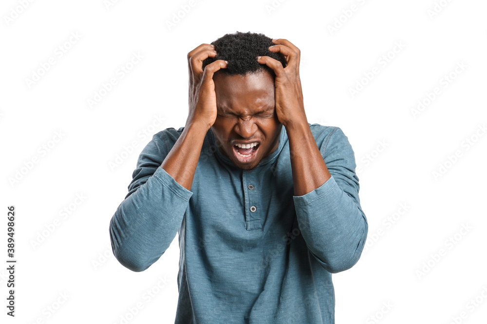 Stressed African-American man on white background Stressed African-American man on white background