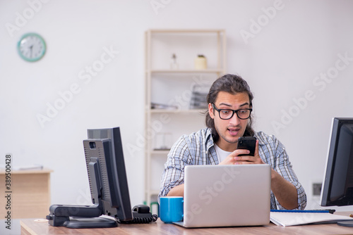 Young male it specialist working in the office