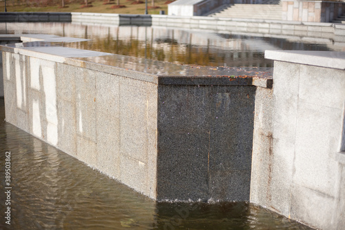 City artificial pond. Stepped fountain. Water tank. 