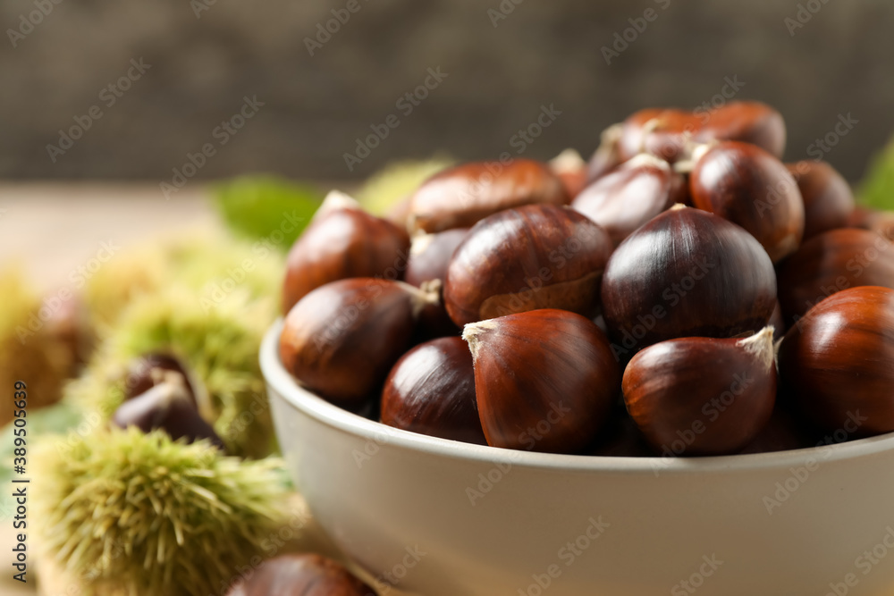 Fresh sweet edible chestnuts in bowl, closeup Fresh sweet edible chestnuts in bowl, closeup