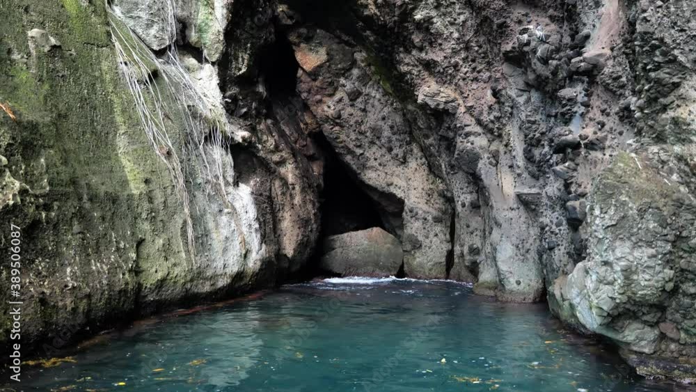bat cave and blue lagoon rocky cliffs Martinique bat entrance bat cave and blue lagoon rocky cliffs Martinique bat entrance