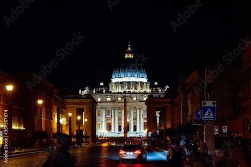 St peters basilica catholic church in Italy Rome during night time with lights on. Architecture and building concept.