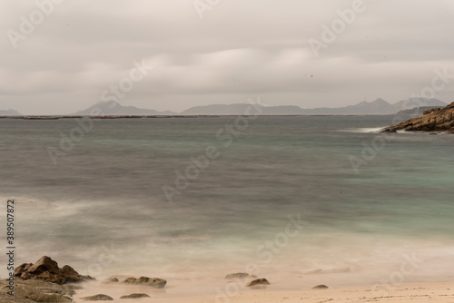 beach and bay of vigo landscape with the cies islands