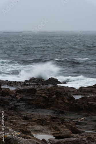 Wave crashing on the rock in the coastline