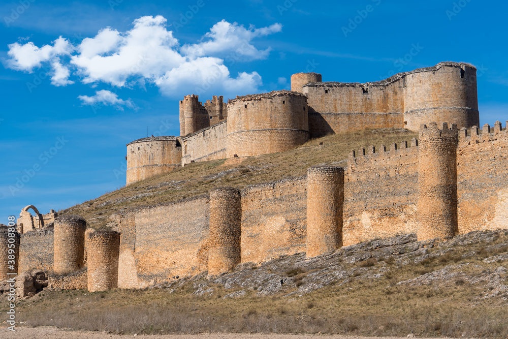 Castillo de Berlanga de Duero is a well-preserved castle located in the homonymous town, in Soria Province, in Castilla y León Region. Location of the Four Musketeers movie with cloudy blue sky.